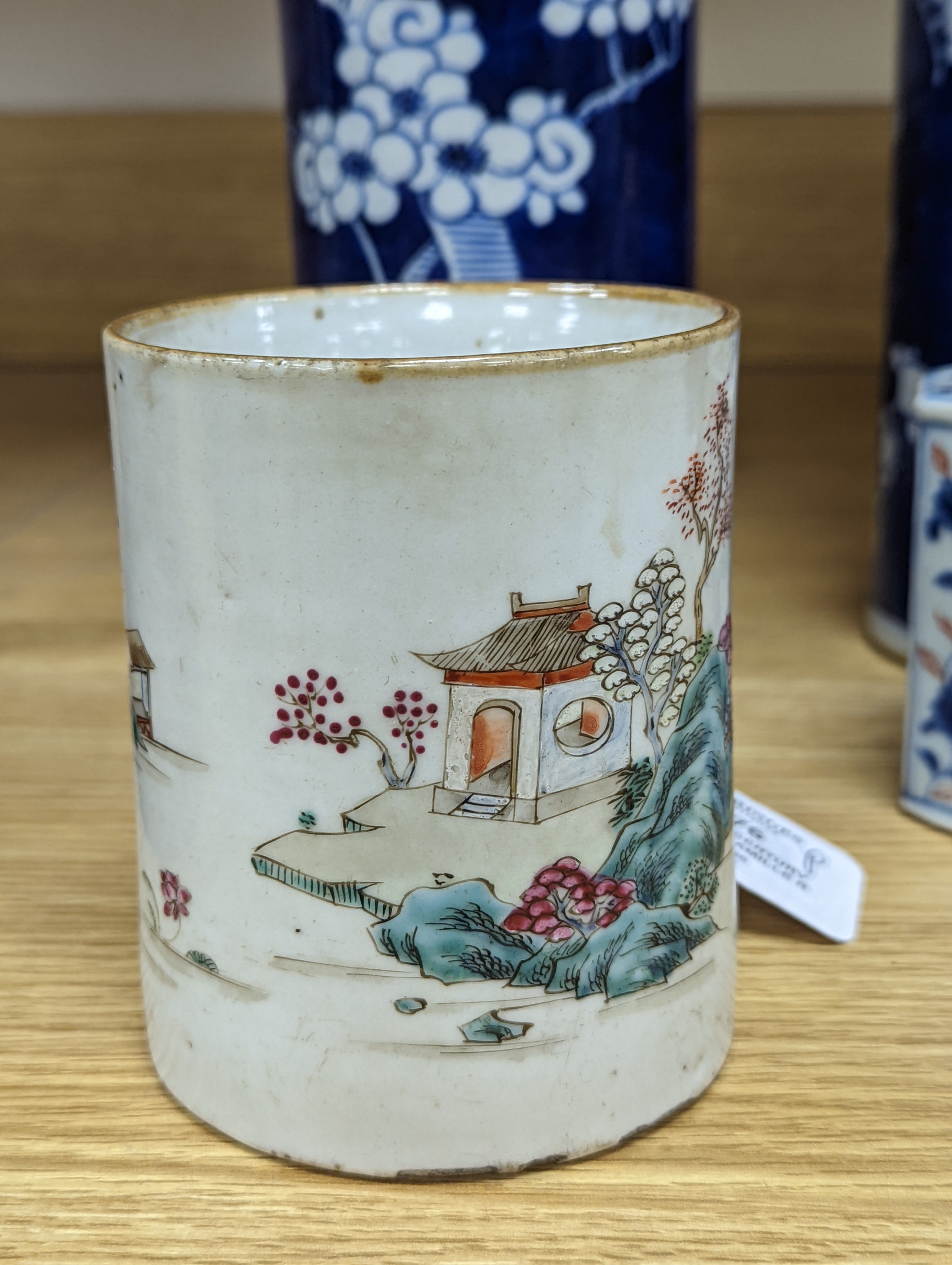 An 18th century Chinese famille rose mug, a Chinese Imari tea caddy and two Chinese blue and white sleeve vases 30cm (4)